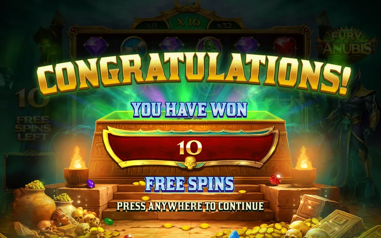 Overwinningsscherm: 10 free spins gewonnen, gouden sarcofaag, tekst druk ergens om door te gaan.